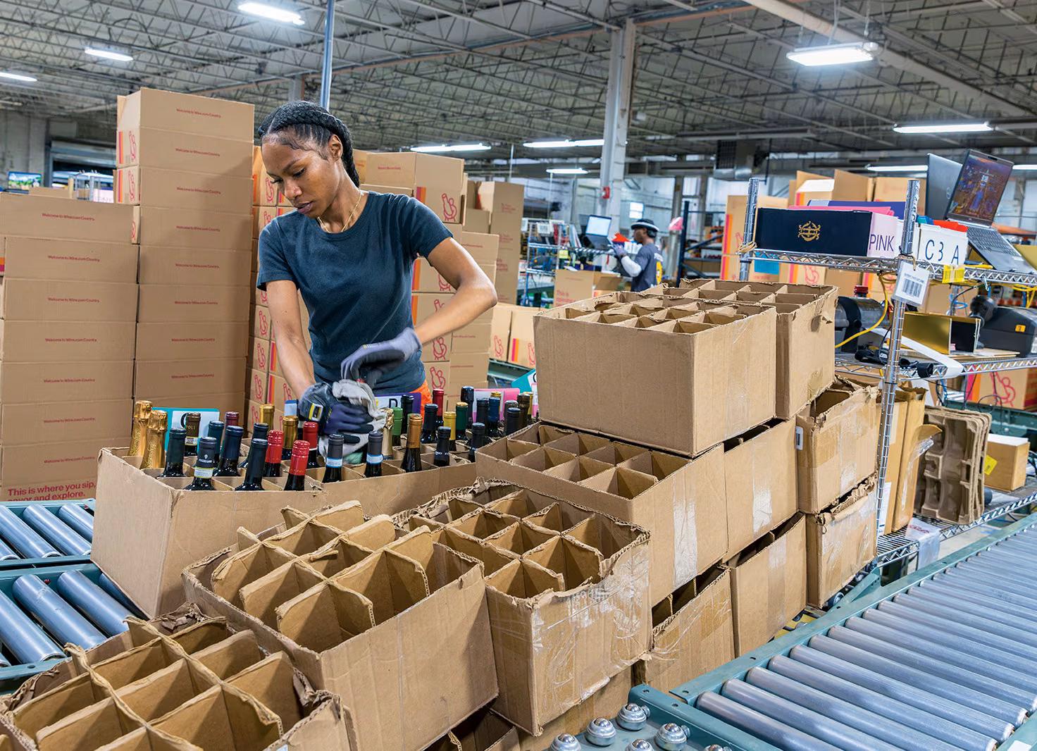 A Wine.com employee packing orders
